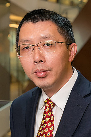 Guoqiang Mao
