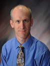 John A. Ozolek